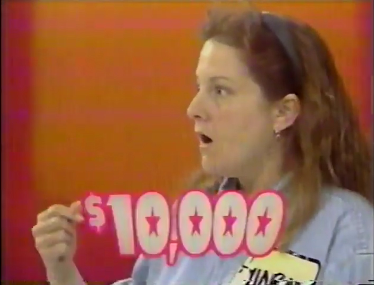 ,000 cash prize revealed on The Price is Right, showing a contestant's surprised expression.