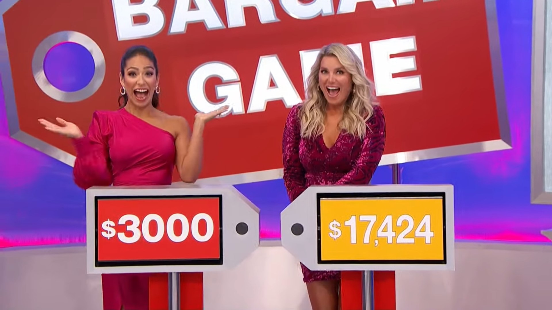 Two contestants excitedly present bargain prices of 00 and ,424 in the Bargain Game.