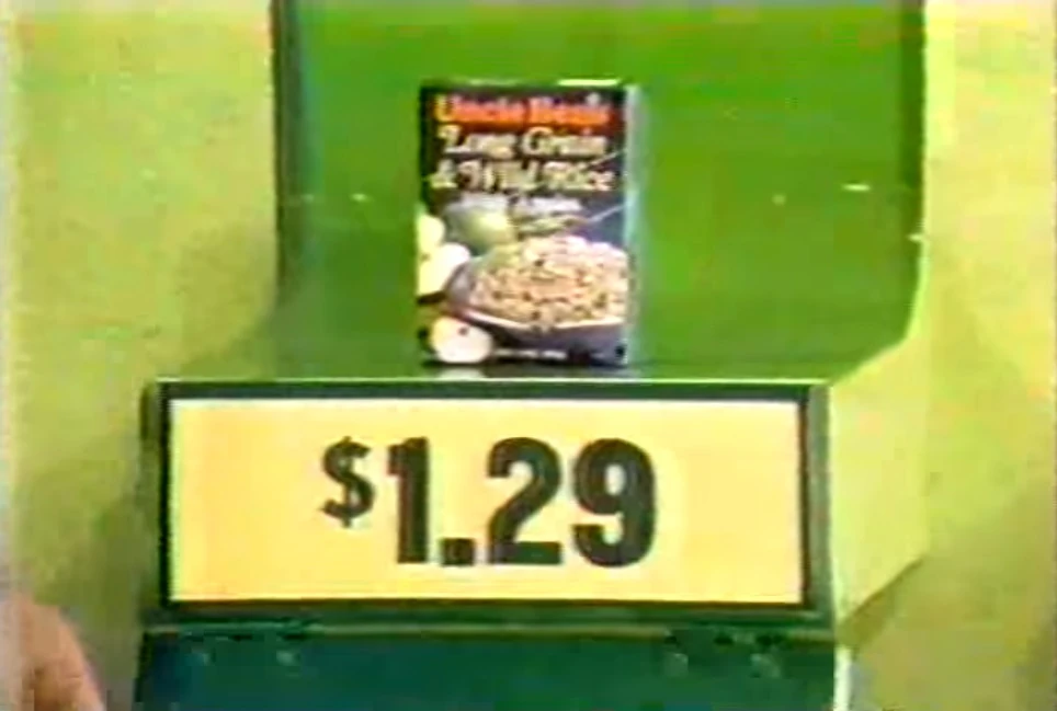 A box of Uncle Ben's long grain and wild rice displayed with a price tag of $1.29.