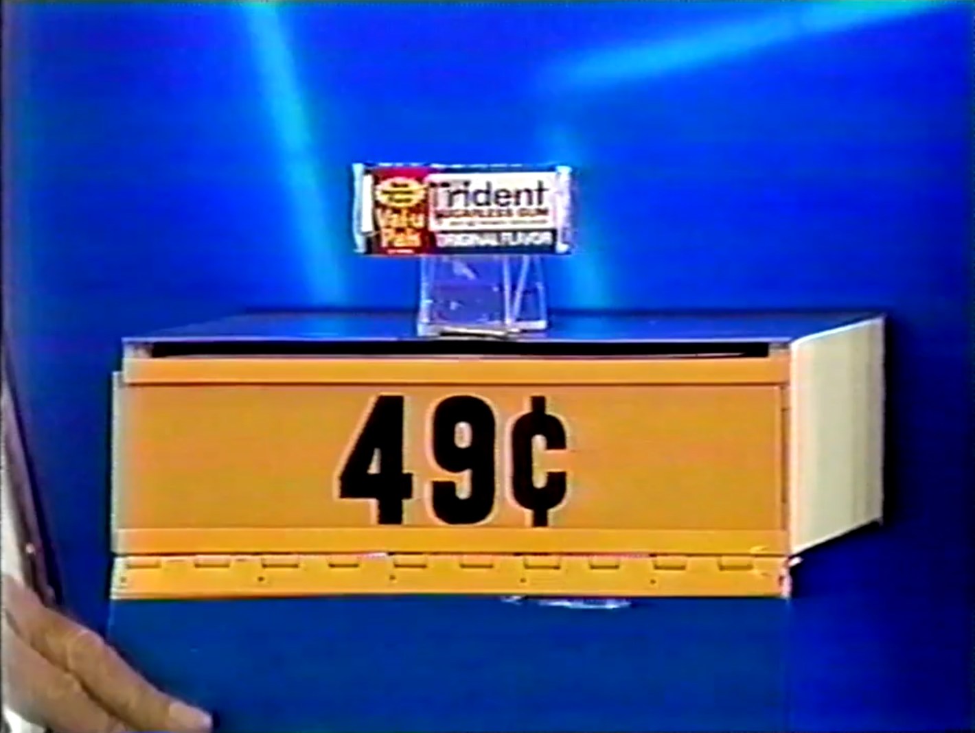 A display featuring a package of Trident gum priced at 49 cents, emphasizing the price for the 'Hit Me' game.
