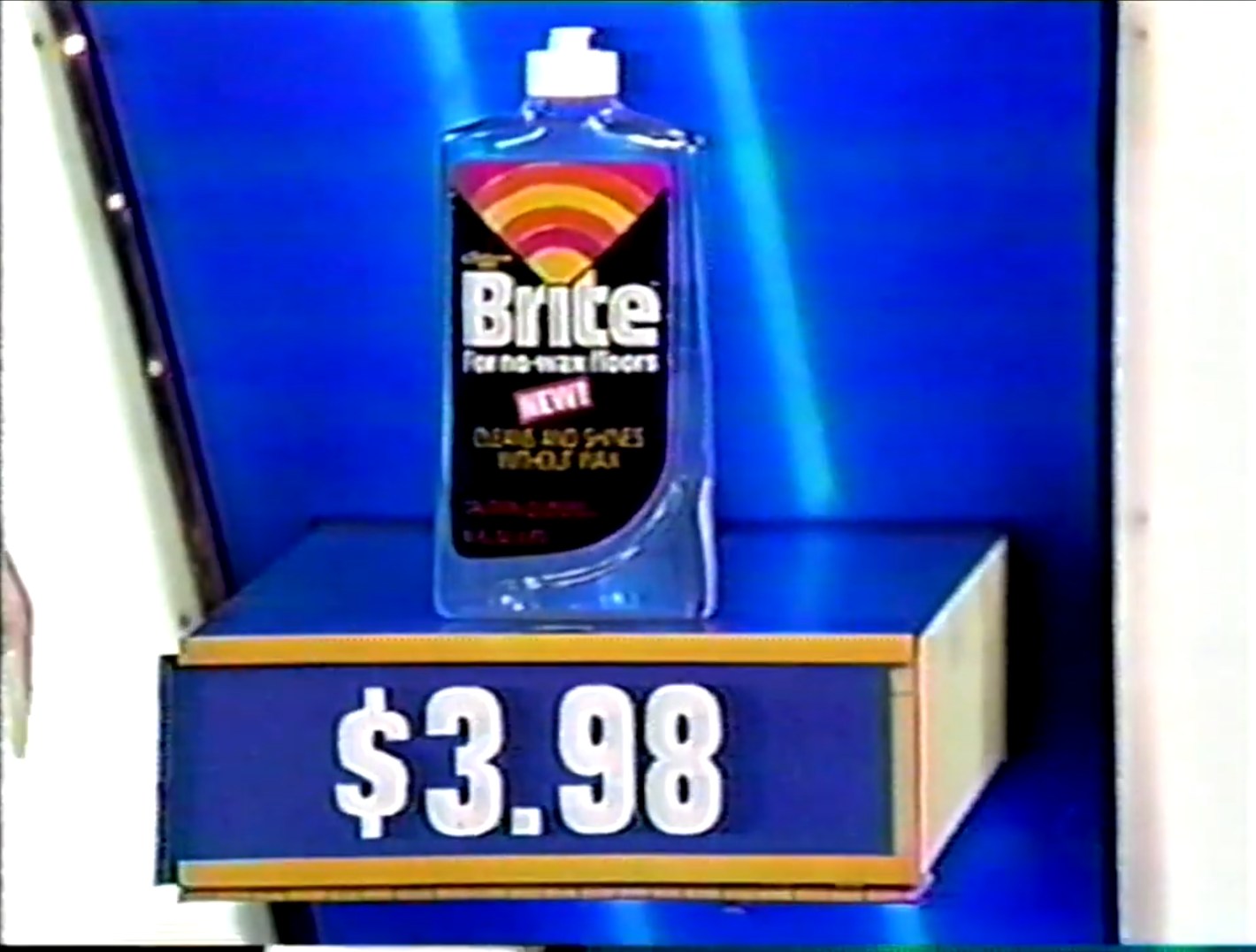 A bottle of Brite cleaner for no-wax floors priced at .98, displayed on a game show set.