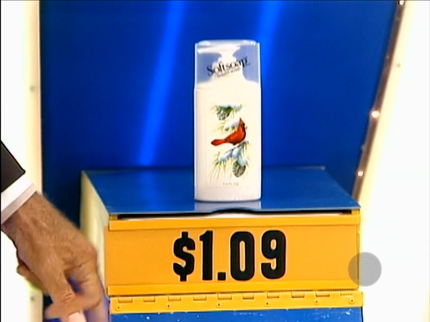 A bottle of Softsoap hand soap featuring a cardinal design, displayed with a price tag of .09.