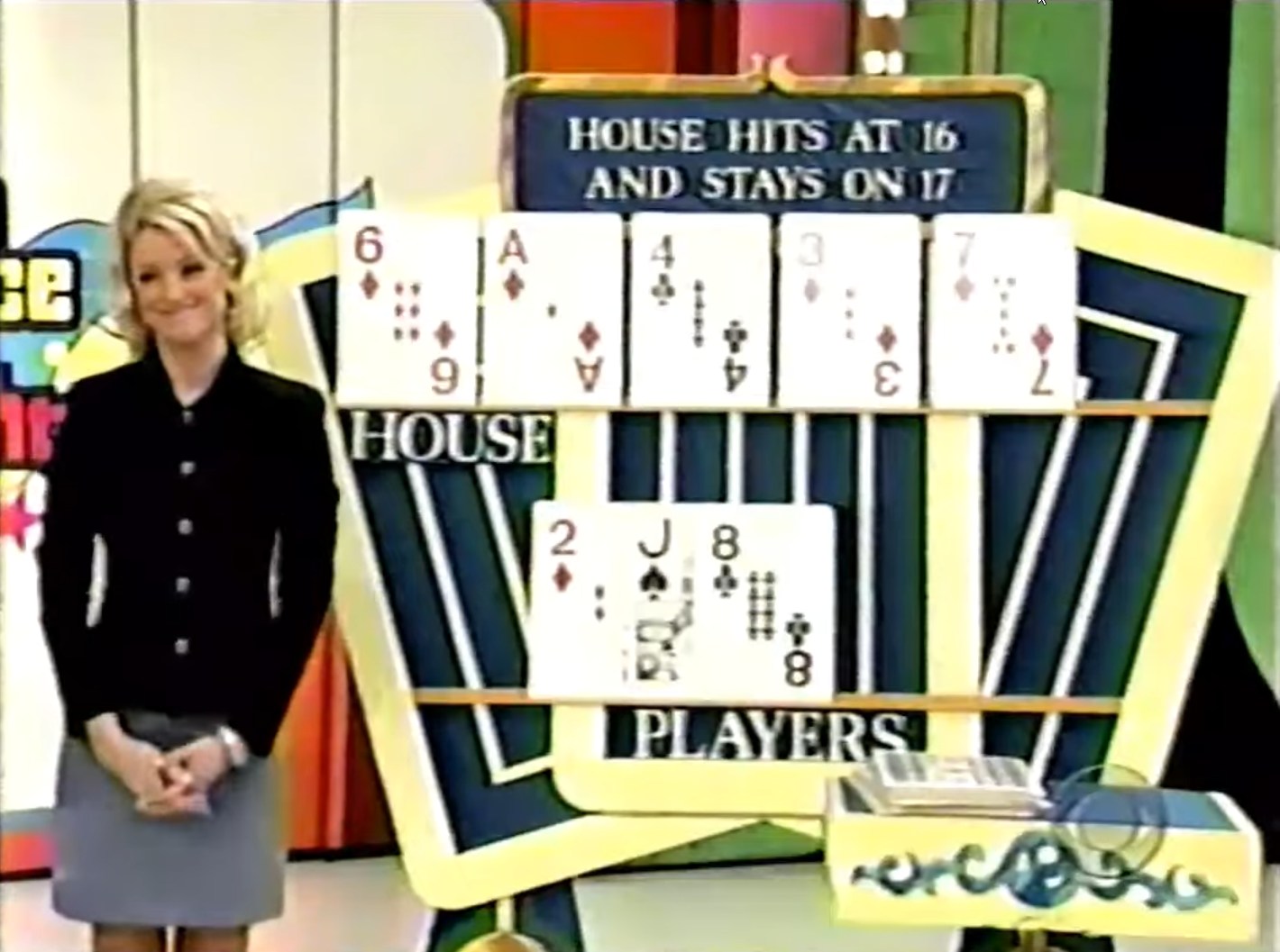 Amodel smiling near a game board displaying the house's cards, including a 6, Ace, 4, 3, and 7, against the player's cards showing a 2, Jack, and two 8s, while the rules for the house hitting at 16 and staying on 17 are visible.