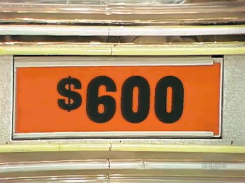 A model turns the displays in Barker's Bargain Bar by hand during a power outage.