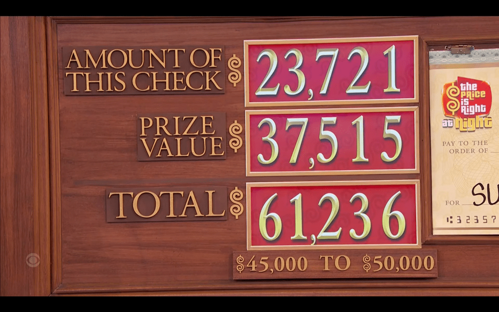Display board showing the check amount of ,721, prize value of ,515, and a total of ,236 in the game 'The Price is Right at Night', with a winning range of ,000 to ,000.