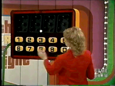Holly Hallstrom punches a contestant's bid into a giant calculator in the Check Out game on the set of The Price is Right.