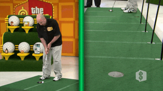 A contestant from The Price is Right preparing to putt on a green putting surface during the Hole in One game, with various grocery products displayed in the background.