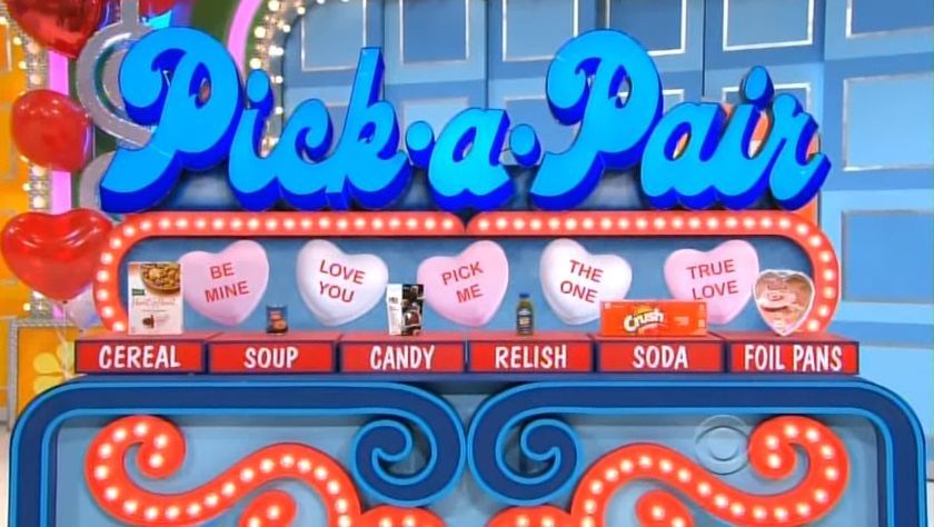 The Pick-a-Pair game set featuring colorful hearts and grocery item labels including cereal, soup, candy, relish, soda, and foil pans.