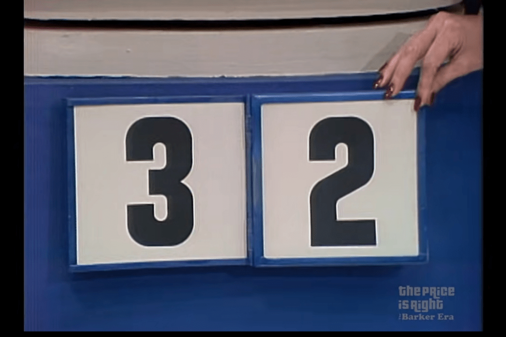 A close-up image of a game display showing the numbers 3 and 2, part of the small prize portion of the pricing game Plinko on The Price is Right.