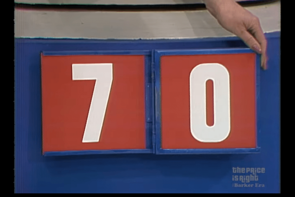 A scoreboard displaying the numbers 7 and 0 on the game show The Price is Right.