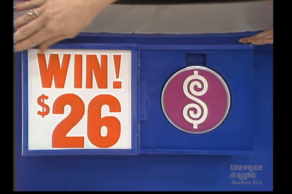 A hand is shown pointing towards a game display with the text 'WIN! ' and a pink circular disc featuring a dollar sign. The background is blue.