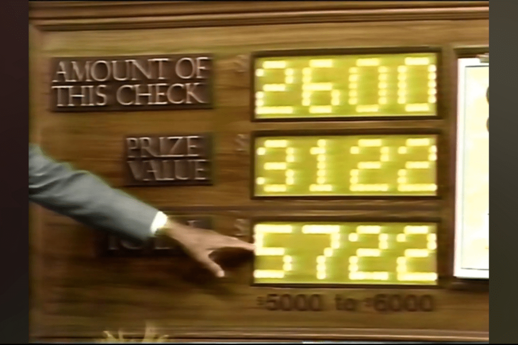 Display panel showing amounts for a game segment, including 'Amount of this check' as ,600, 'Prize value' as ,122, and 'Total' as ,722 with winning range of ,000 to ,000.