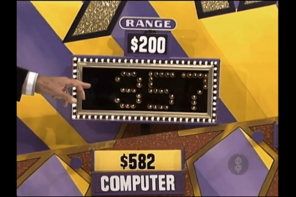 Display showing a range of 0 for a computer with a current price of 2 and a guess of 7.