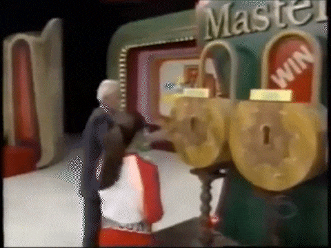 Bob Barker whacking a key prop against a lock in the Master Key game, accidentally knocking one of the magnets loose.