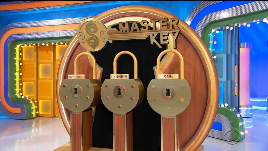 A display of three locks on the game show Master Key, with labels for a car, gym membership, and delivery service.
