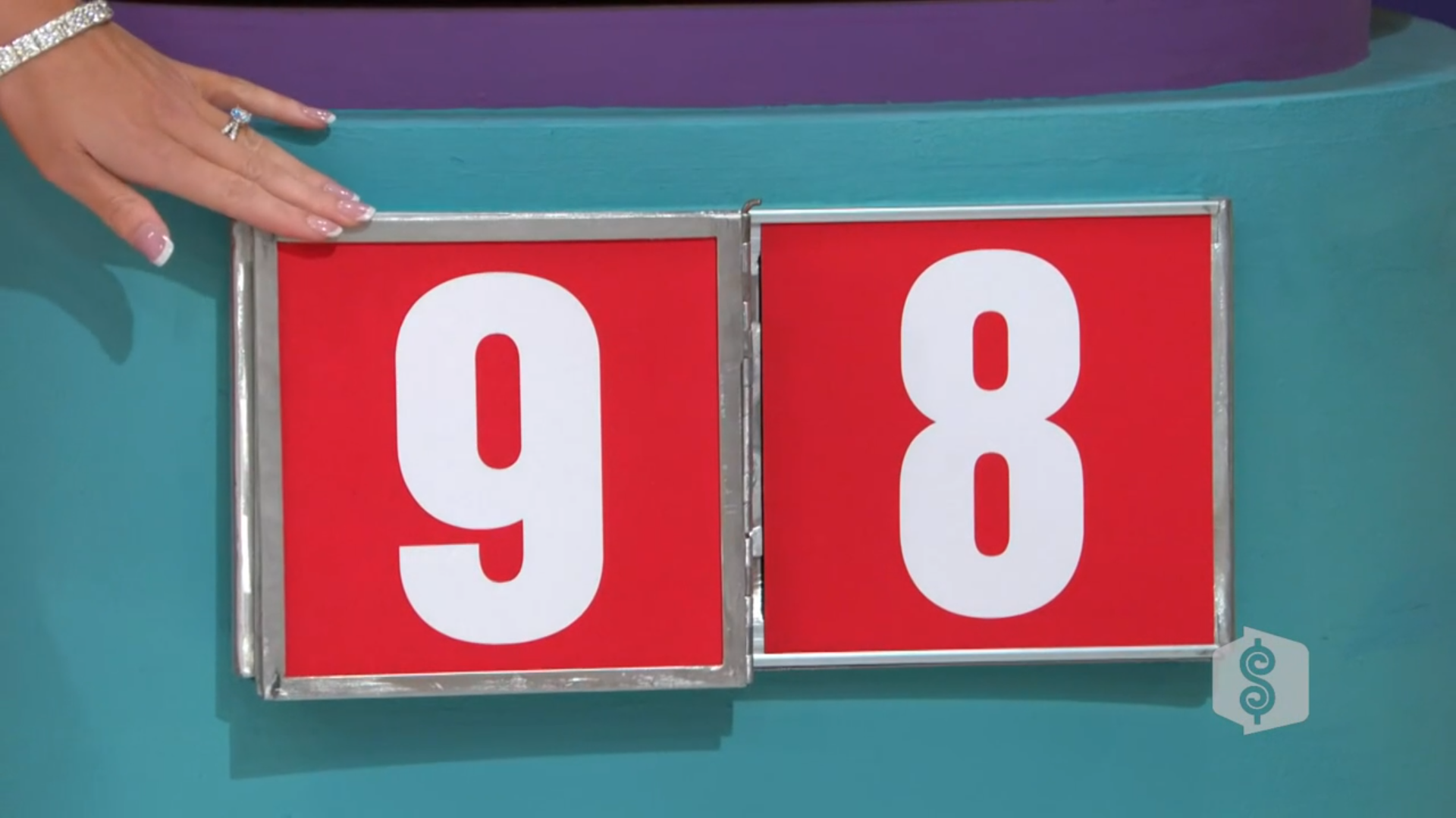 A close-up image of a game board featuring large red numbers, '9' and '8', displayed prominently.