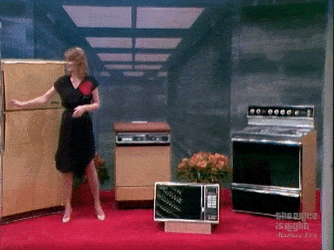 Holly Hallstrom struggles to close the door on a Gibson refrigerator inside the Safe Crackers set on The Price is Right.