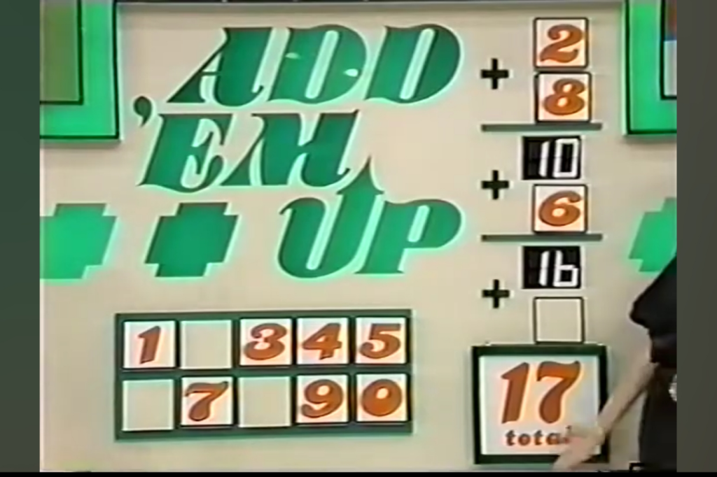 Game board display for Add 'Em Up, showing arithmetic calculations leading to a total of 17, with the digits 2, 8, and 6 featured.