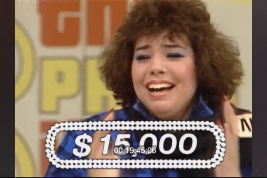 A contestant on The Price is Right reacts emotionally while celebrating a win of ,000 during a game.