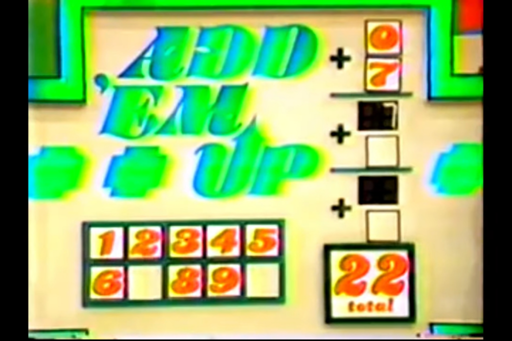 Add 'Em Up game board showing digits and total in a colorful layout for a car price guessing game.