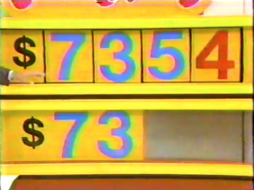 A colorful display showing the incorrect price ,354 for a car, with a highlighted bottom row showing the correct digits ___.