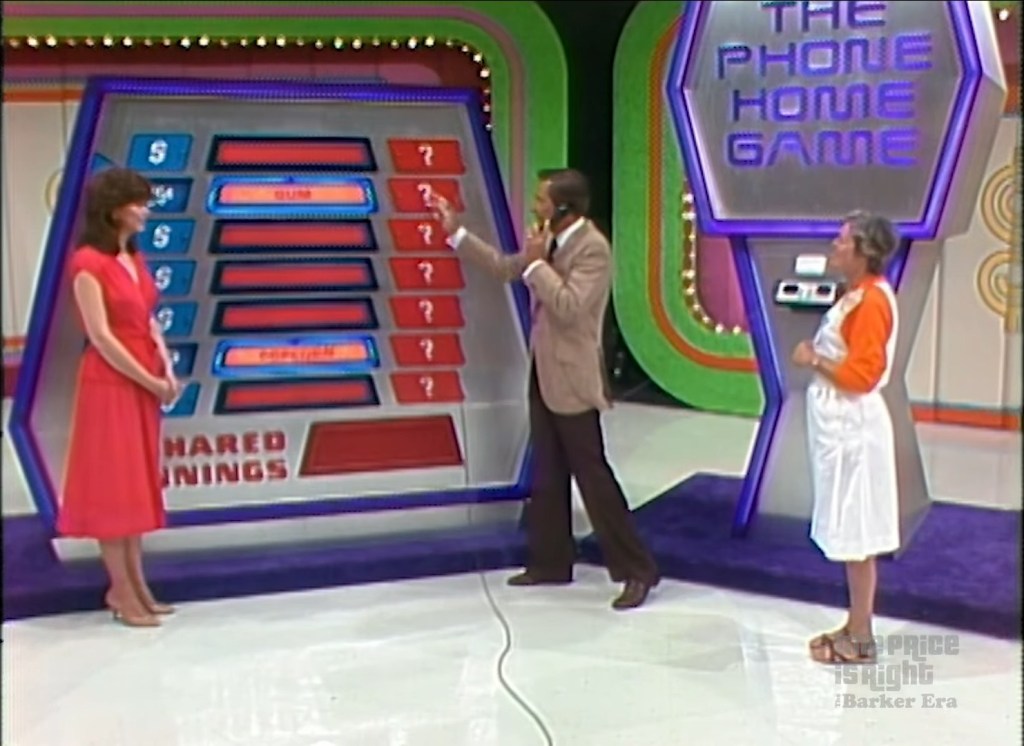 Contestants participating in The Phone Home Game on The Price is Right, showcasing the game board with shared earnings displayed.