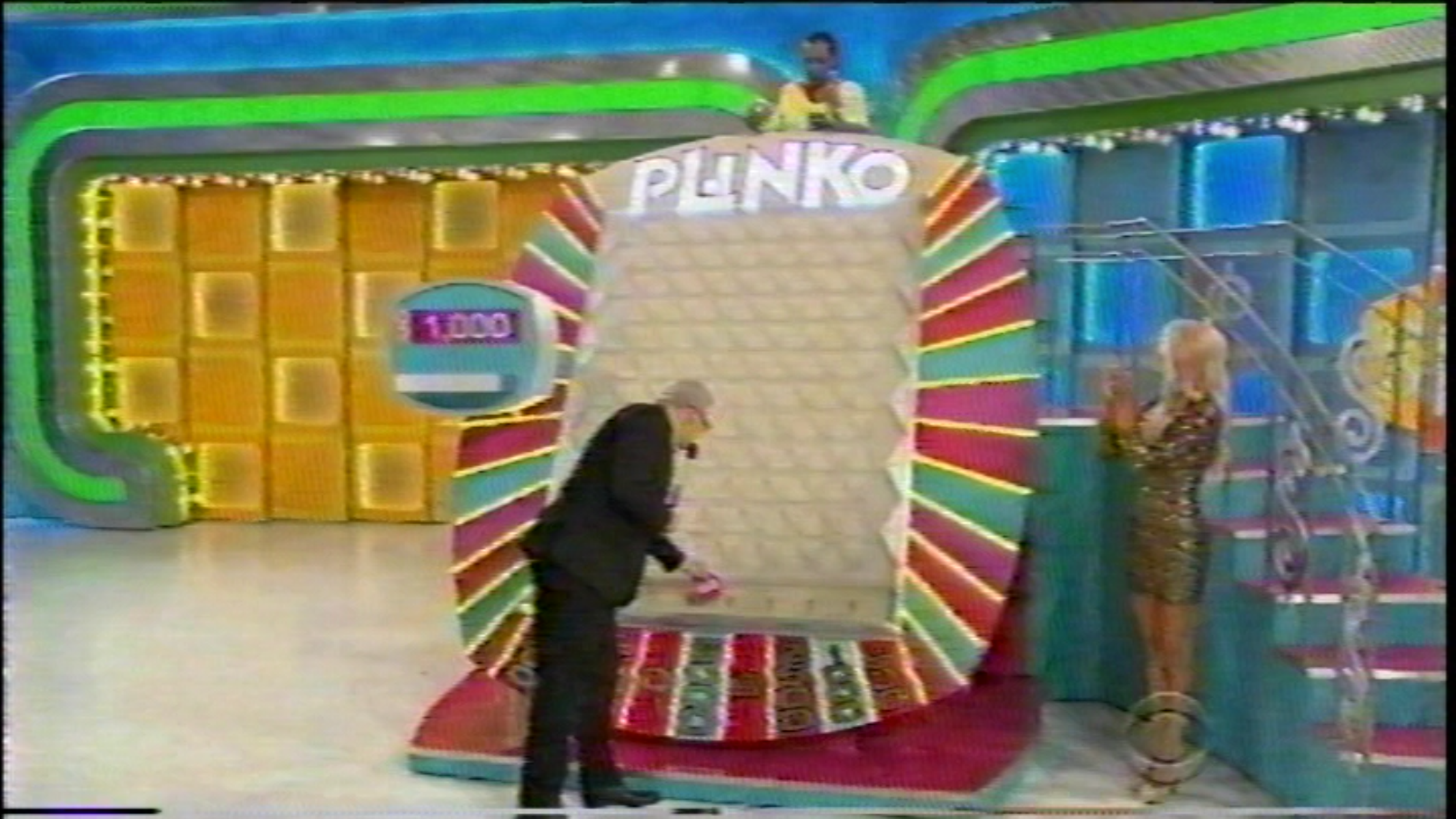 A contestant winning $1,000 on The Price is Right.
