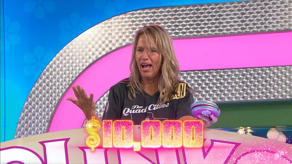 A contestant reacts joyfully while holding a Plinko chip on The Price is Right, with a ,000 prize displayed in front.