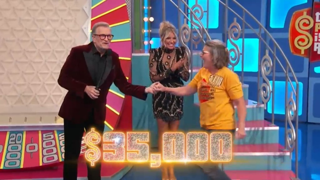 Contestant celebrating after winning ,000 on The Price is Right with Drew Carey and a model in the background.