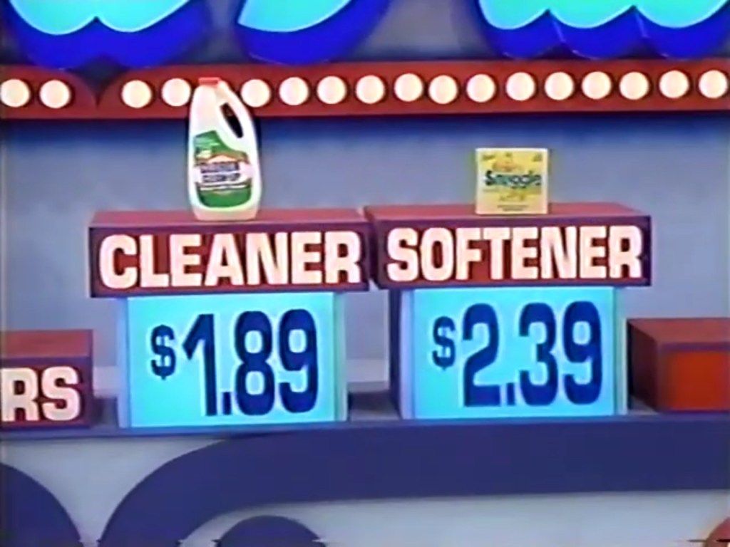 Two displayed products with prices: a bottle of cleaner priced at .89 and a box of softener priced at .39.